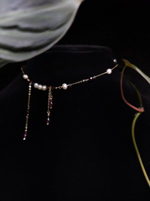 red necklace with pearls